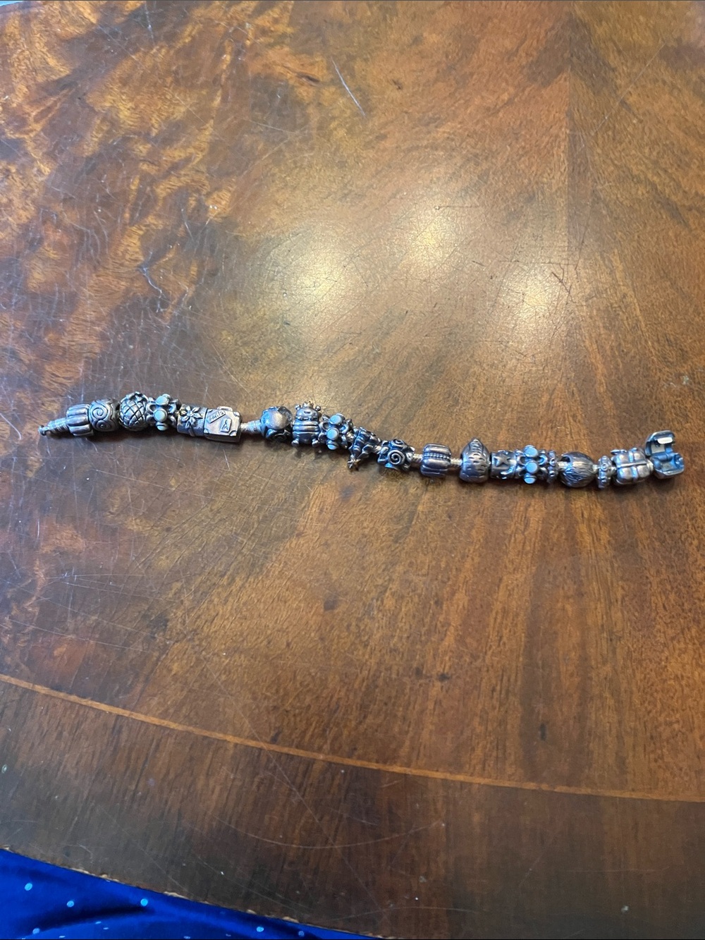Pandora- Full Bracelet. Some charms with 14 kt gold accents.
